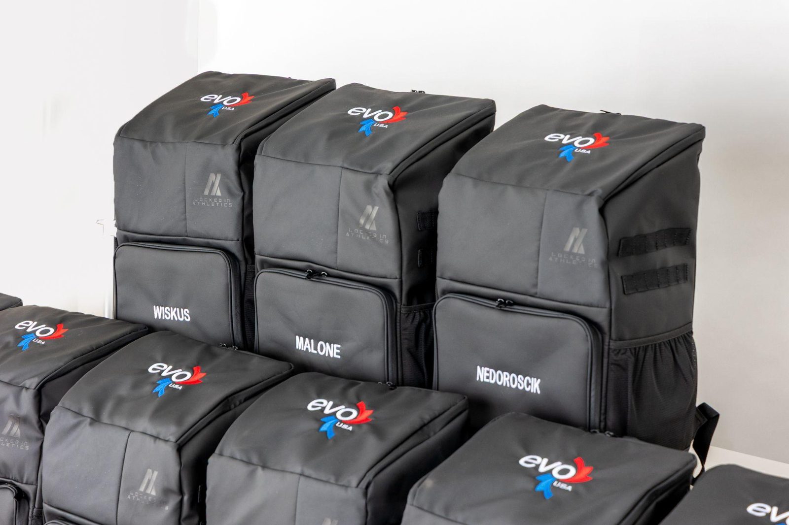 Evo USA custom backpacks with heat pressed sublimated logos for Wiskus, Malone, and Nedoroscik